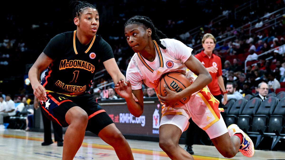 Mar 28, 2023; Houston, TX, USA; McDonald’s All American East guard Milaysia Fulwiley (12) drives to the basket as McDonald’s All American West guard KK Arnold (1) defends during the first half at Toyota Center. Mandatory Credit: Maria Lysaker-USA TODAY Sports