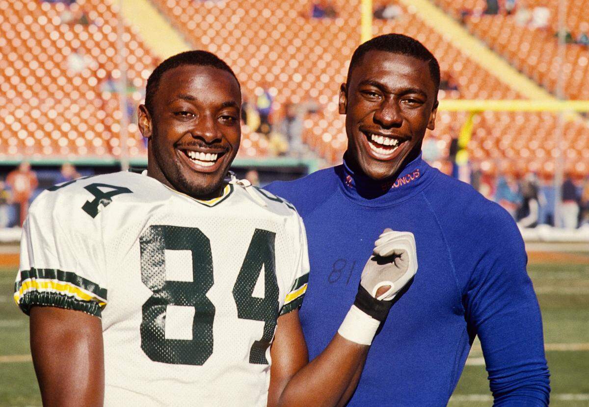 File photo: Green Bay Packers receiver Sterling Sharpe (left) poses with his younger brother Denver Broncos receiver Shannon Sharpe (right) at Mile High Stadium.
