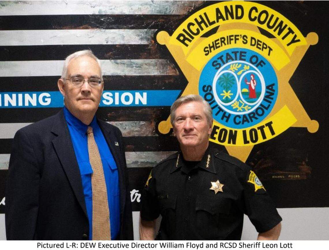 South Carolina Department of Employment and Workforce Director William Floyd, left, and Richland County Sheriff Leon Lott.
