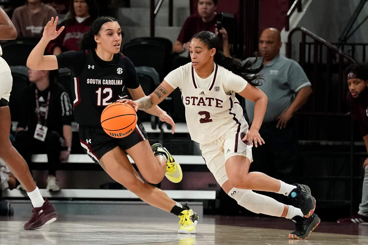 Mississippi State guard JerKaila Jordan (2) dribbles past South Carolina guard Brea Beal (12) during the second half of an NCAA college basketball game in Starkville, Miss., Sunday, Jan. 8, 2023. South Carolina won 58-51. (AP Photo/Rogelio V. Solis)