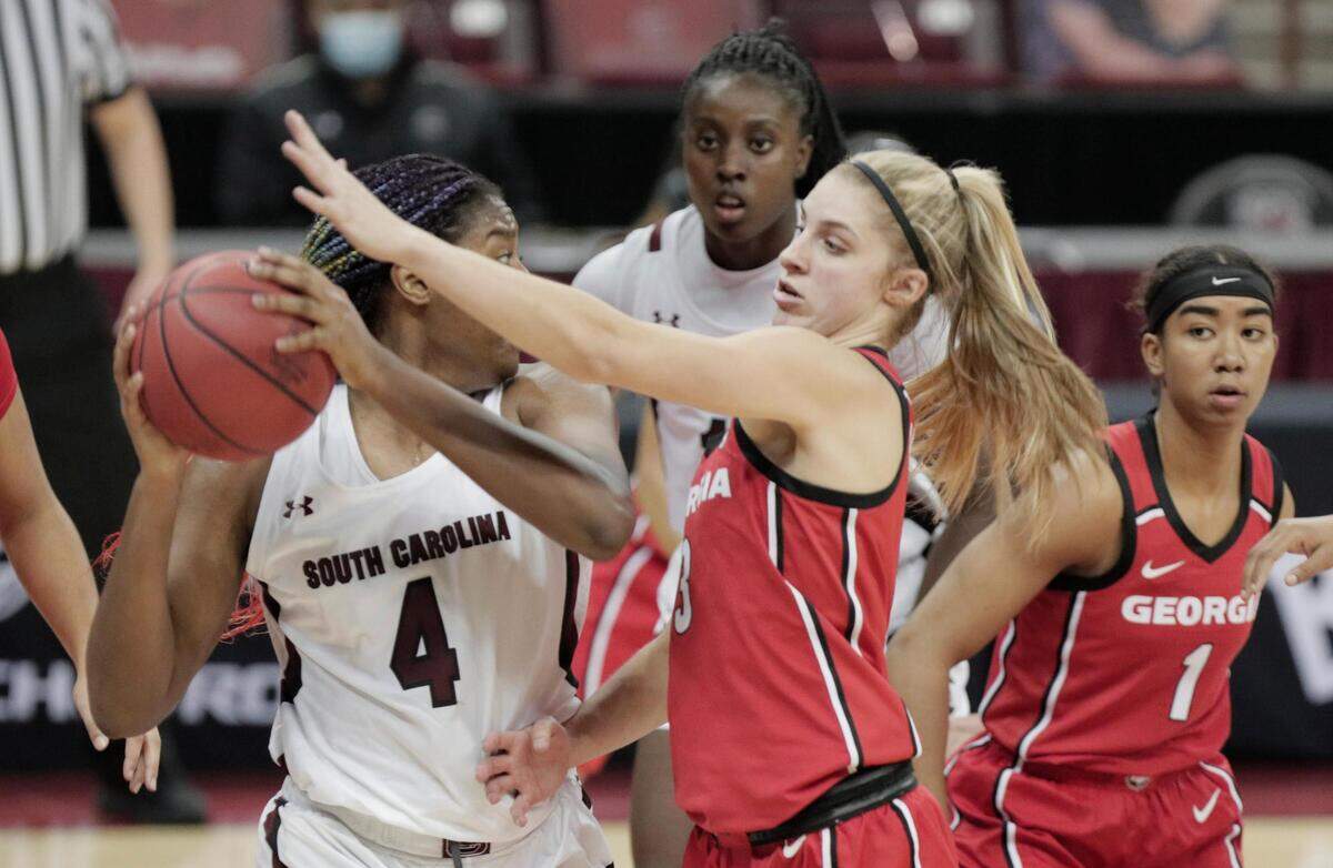 South Carolina Gamecocks forward Aliyah Boston (4) tries to pass as South Carolina Gamecocks guard Destanni Henderson (3) guards at Colonial Life Arena on Thursday, January 21, 2021.