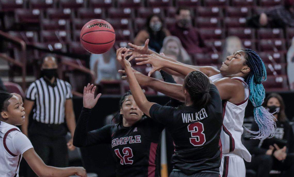 South Carolina Gamecocks forward Aliyah Boston (4) grapples for a ball with Temple guard Emani Mayo (12) and Temple guard Rayniah Walker (3) during the first half of action at the Colonial Life Arena.