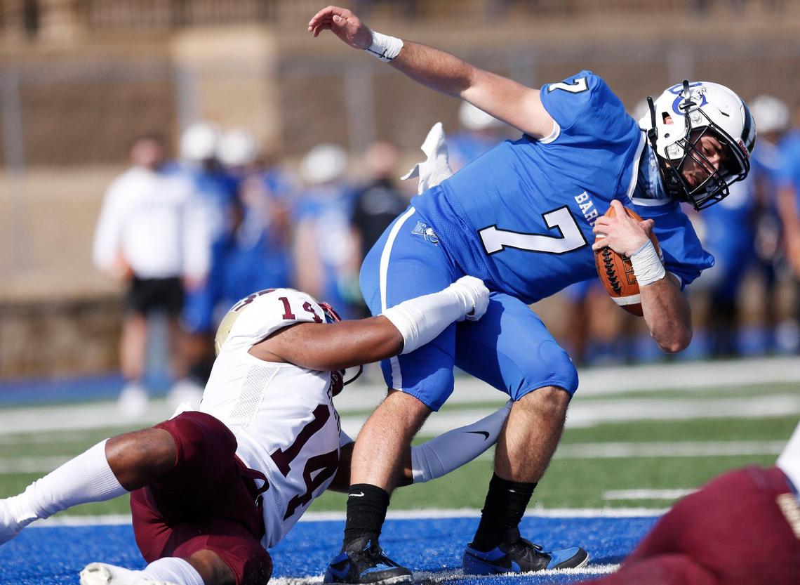Barton quarterback Tyler Flippen (7) is sacked for a safety by Erskine linebacker Brandon Lane (14) in the first quarter of the game Saturday.