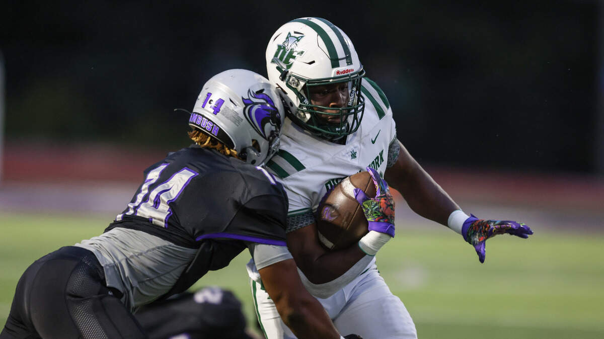 Dutch Fork running back Maurice Anderson (30) gets hit by Ridge View linebacker D’Juan Franklin (14) during Ridge View’s game against Dutch Fork in Columbia on Friday, September 6, 2024.