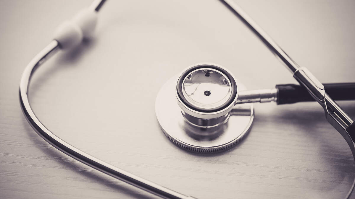Close-up shot of stethoscope on table.