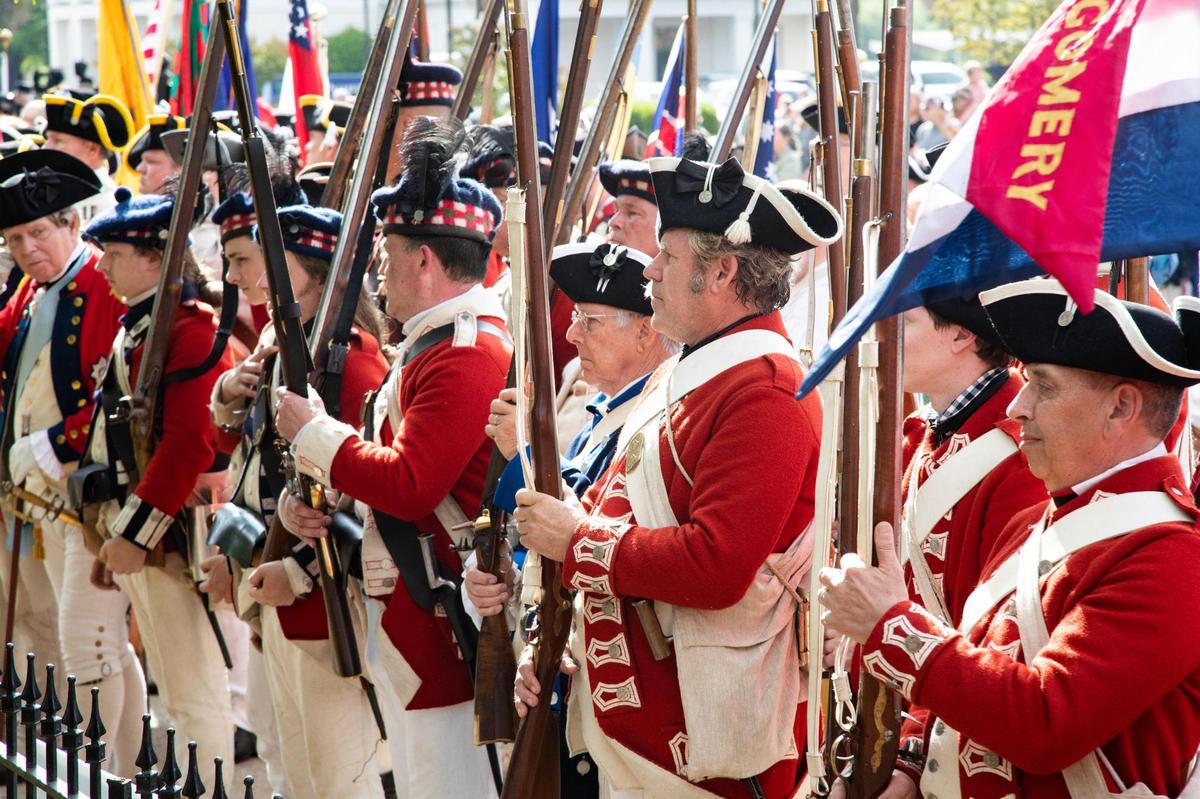 Historical reenactors attend a funeral for fourteen American and British soldiers who died fighting in the American Revolution in Camden, South Carolina on Saturday, April 22, 2023.