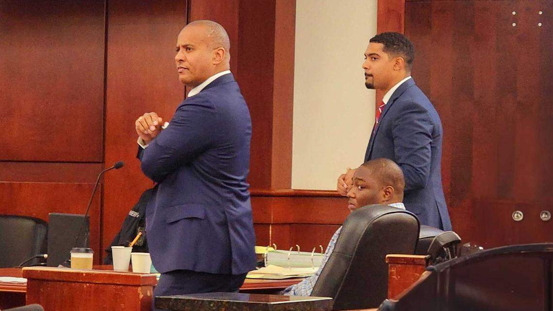 Jewayne Price seated, flanked by his attorneys Todd Rutherford and Austin Nichols, as he stands trial, October 24, 2024, for his involvement in the 2022 Columbiana mall shooting.