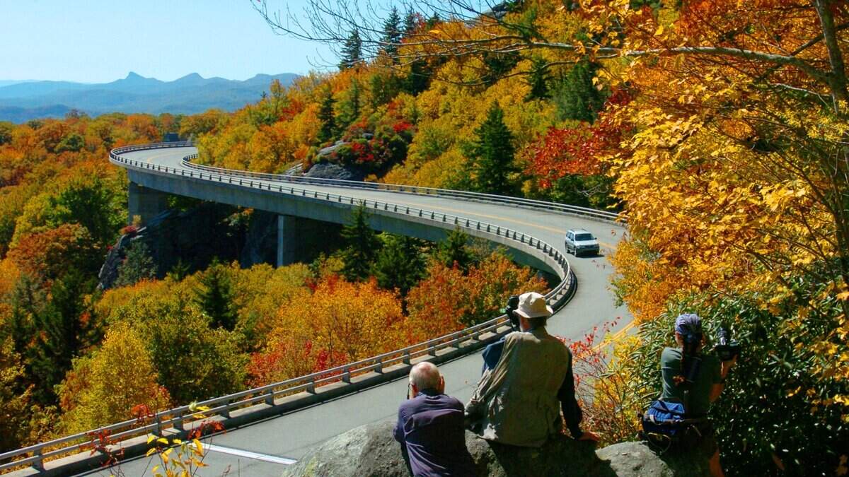 In this file photo, people took pictures of the fall colors along the Blue Ridge Parkway. A deadly car crash occurred along the picturesque road Saturday, Sept. 1, 2018.