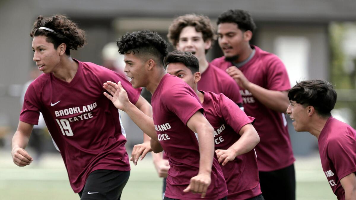 Brookland-Cayce’s Eduardo Moisa Membreno celebrates with teammates after scoring against Daniel at Irmo High School on Saturday.