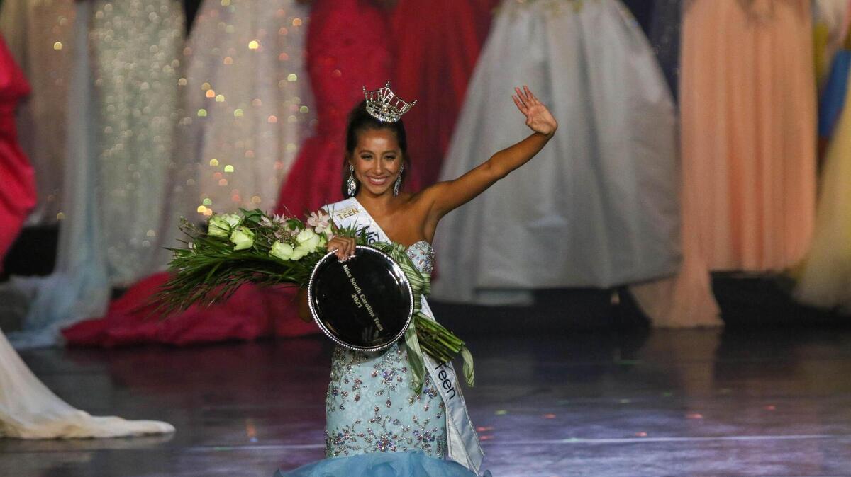 Dabria Aguilar waves to the crowd after being crowned the 2021 Miss Teen South Carolina during the annual pageant at the Township Auditorium on Friday, June, 25, 2021.