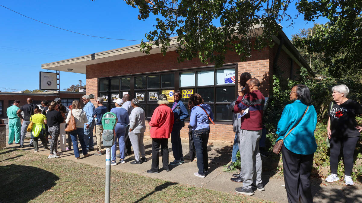 Voters stand in line outside an early voting center on Hampton Street in Columbia on the first day of early voting on Monday, Oct. 21, 2024.