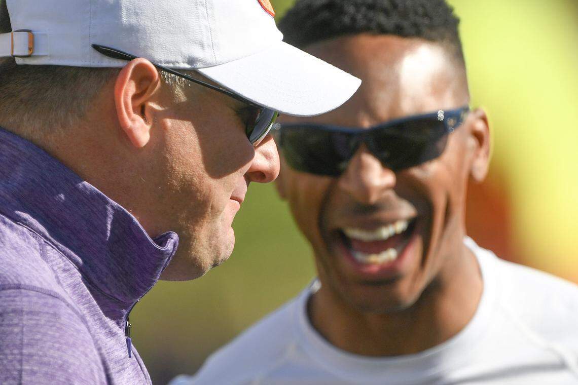 Clemson Tigers former players Jeff Scott (left) and Chansi Stuckey share a laugh before a 2023 game against the Notre Dame Fighting Irish at Memorial Stadium.