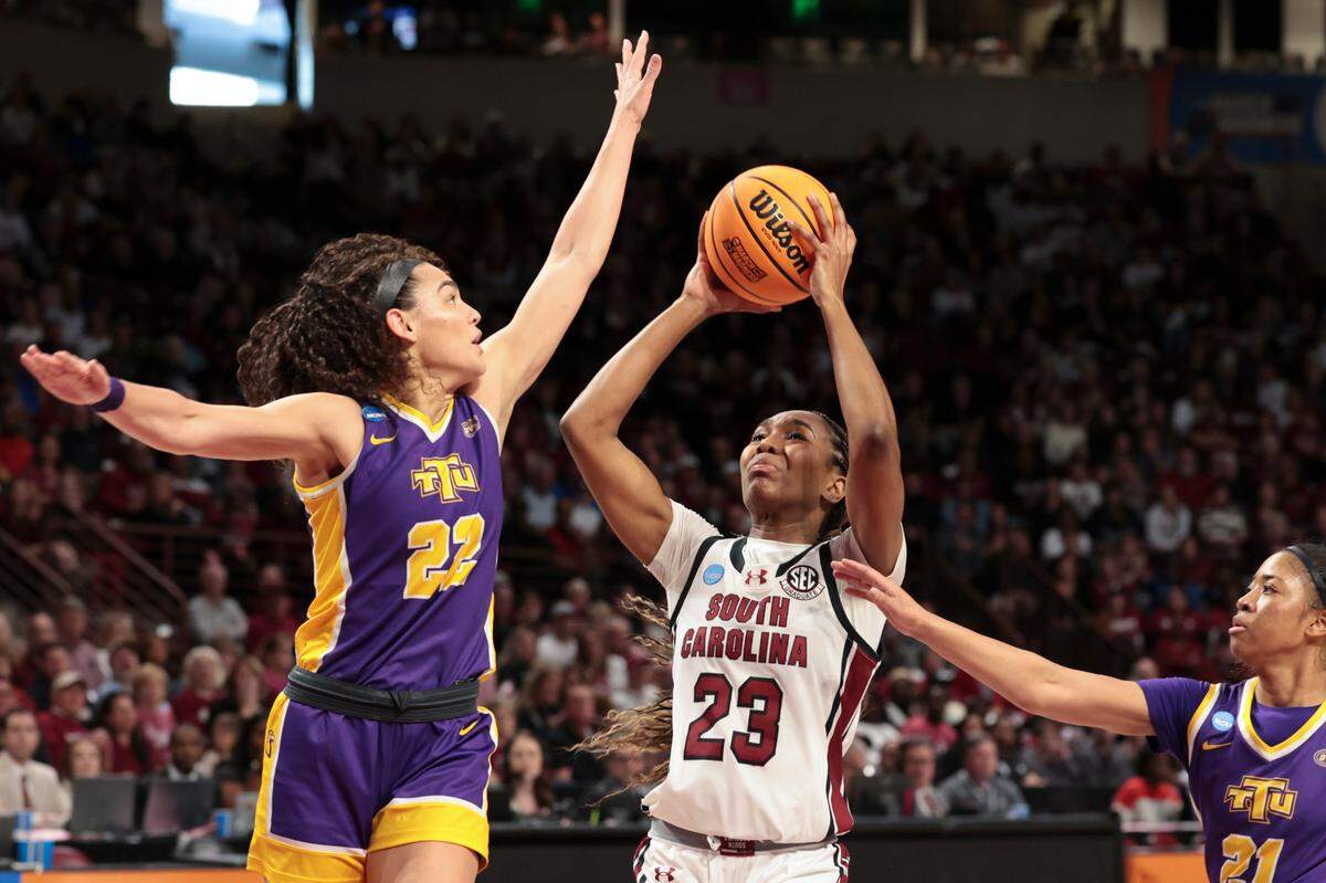 University of South Carolina’s Bree Hall (23) shoots as Tennessee Tech’s Peyton Carter (22) and Chloe Larry (21) pressure during the first half of action in the First Round game of the NCAA Tournament at the Colonial Life Arena on Friday, March 21, 2025.