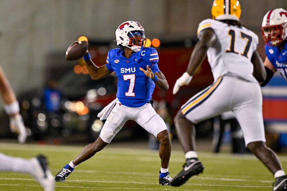 Nov 30, 2024; Dallas, Texas, USA; Southern Methodist Mustangs quarterback Kevin Jennings (7) throws for a touchdown. SMU enters Charlotte with an 11-1 record and is slightly favored over Clemson in the ACC title game.