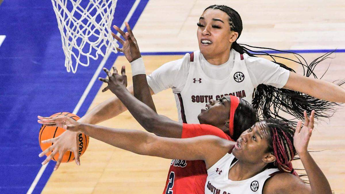 South Carolina’s Brea Beal blocks a shot by University of Mississippi guard Marquesha Davis near teammate South Carolina forward Aliyah Boston (4) during Saturday’s SEC tournament game at Bon Secours Wellness Arena in Greenville.