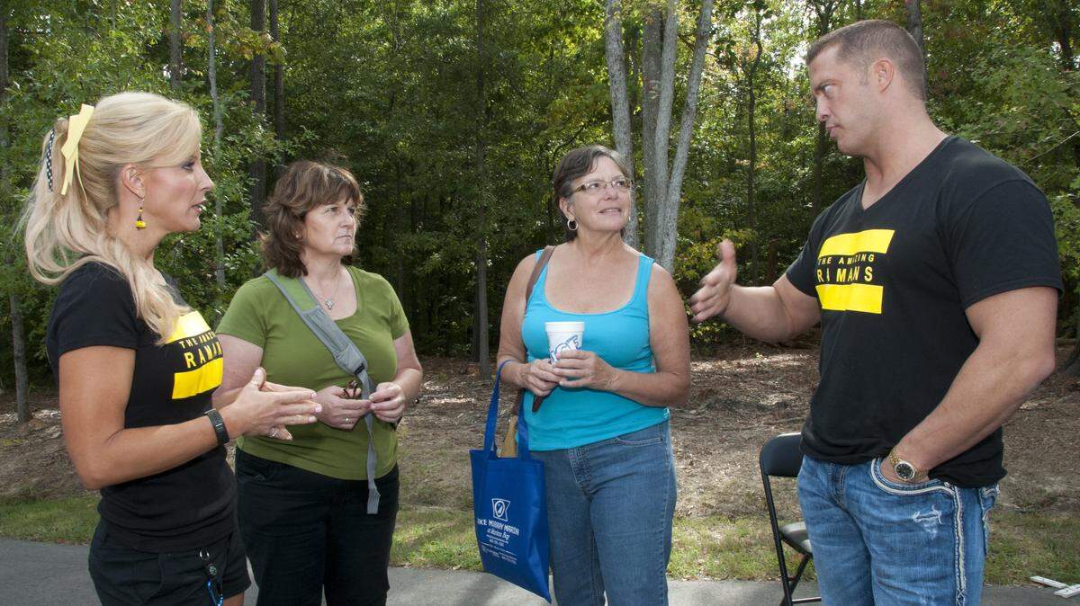 Columbia dentist Jim Raman, right, who appeared on the CBS show "Amazing Race" with his wife Misti, left, has died.