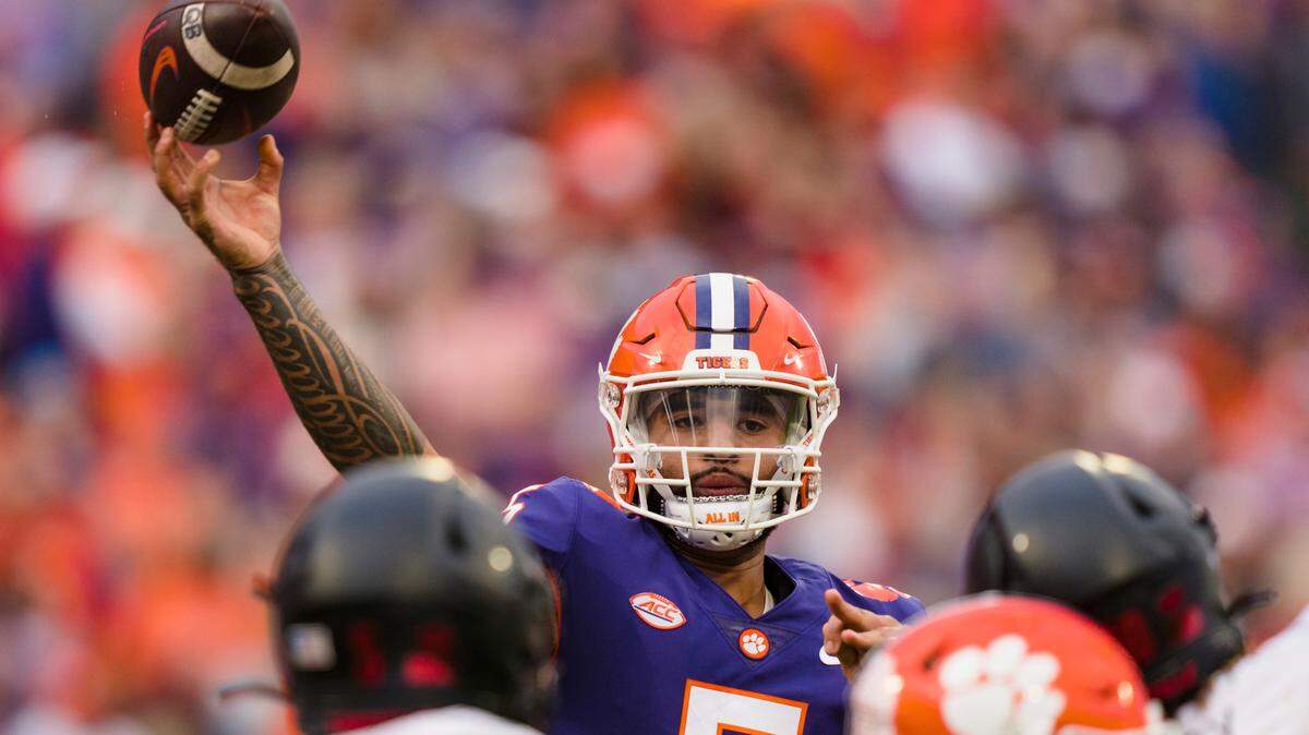 Clemson quarterback DJ Uiagalelei (5) passes the ball in the first half of an NCAA college football game against Louisville, Saturday, Nov. 12, 2022, in Clemson, S.C. (AP Photo/Jacob Kupferman)