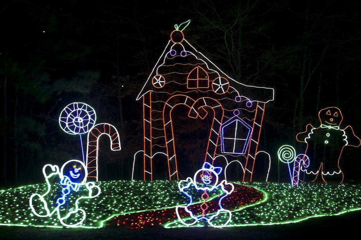 A festive holiday scene unfolds in Saluda Shoals Park as motorists drive through during the Holiday Lights on the River on Wednesday, Dec. 3, 2025. The annual event features three miles of lighted animated displays, a walking trial with a laser light show, and hay rides.