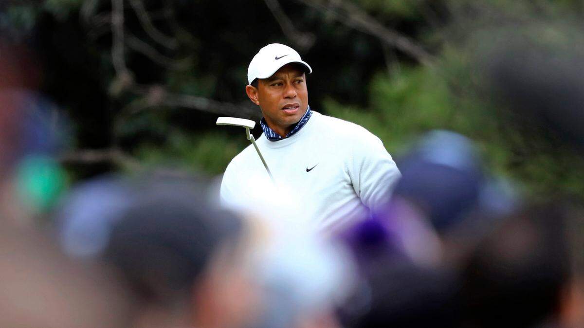Tiger Woods putts on the first green during the third round of the Masters golf tournament at Augusta National on Saturday, April 9, 2022, in Augusta, Ga. (Curtis Compton/Atlanta Journal-Constitution via AP)