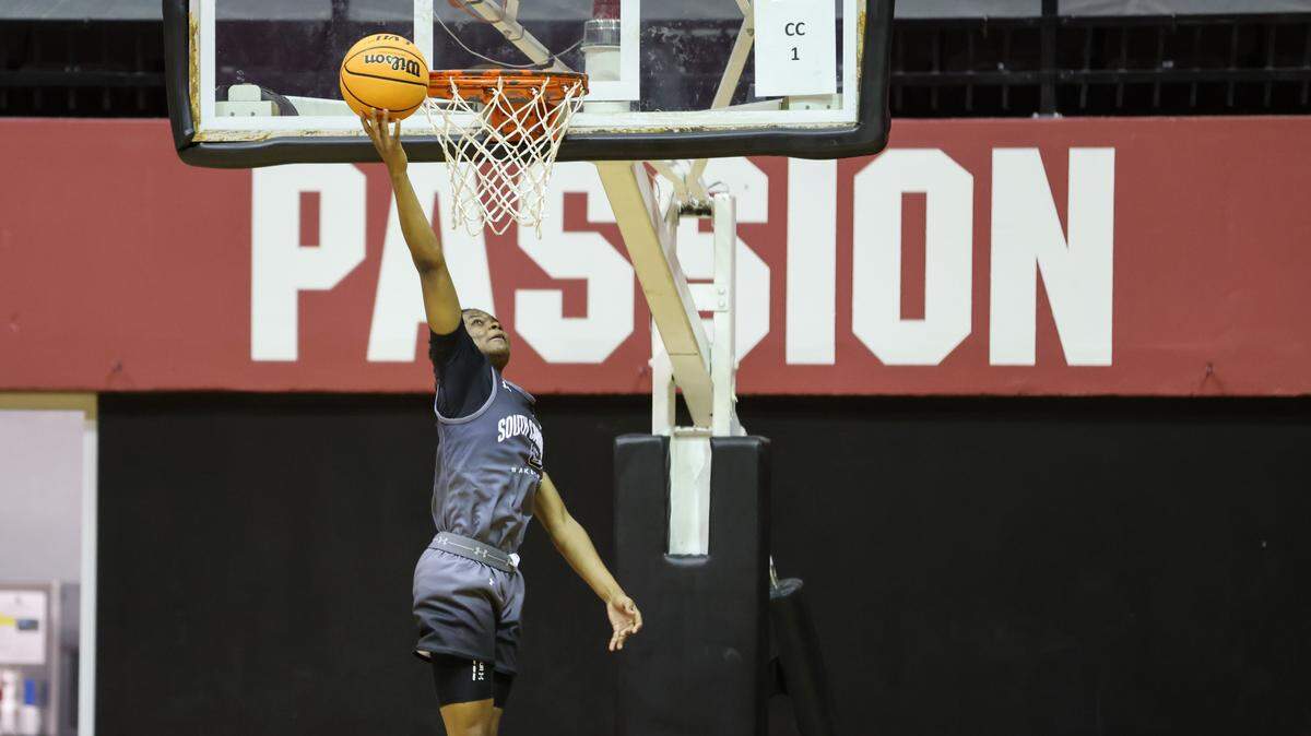 South Carolina guard MiLaysia Fulwiley (12) attempts to dunk during practice at Carolina Coliseum in Columbia on Thursday, September 28, 2023.