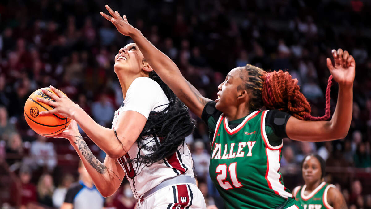 Nov 24, 2023; Columbia, South Carolina, USA; South Carolina Gamecocks center Kamilla Cardoso (10) drives past Mississippi Valley State Devilettes forward Amberly Brown (21) in the first half at Colonial Life Arena. Mandatory Credit: Jeff Blake-USA TODAY Sports