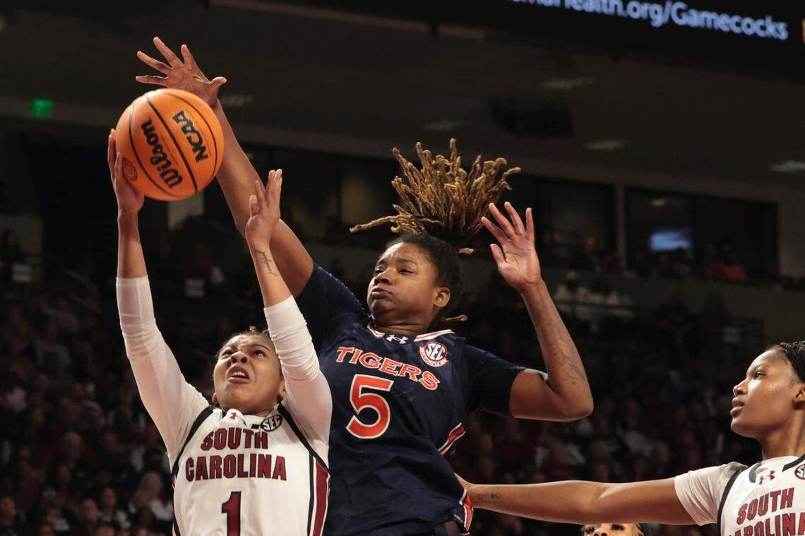 University of South Carolina’s Maddy McDaniel (1) shoots as Auburn’s DeYona Gaston (5) pressures during the first half of action in the Colonial Life Arena on Sunday, Feb. 2, 2025.