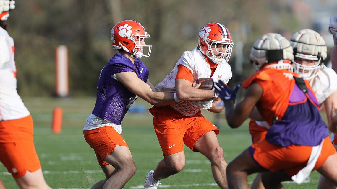 Clemson quarterback Cade Klubnik (2) hands the ball off to Will Shipley (1) during spring practice in Clemson on March 6 , 2023