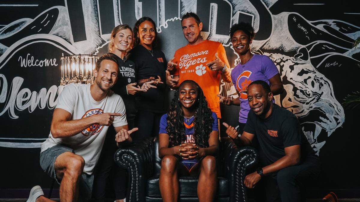 Five-star 2026 recruit Trinity Jones poses with the Clemson women’s basketball coaching staff during her official visit to campus.