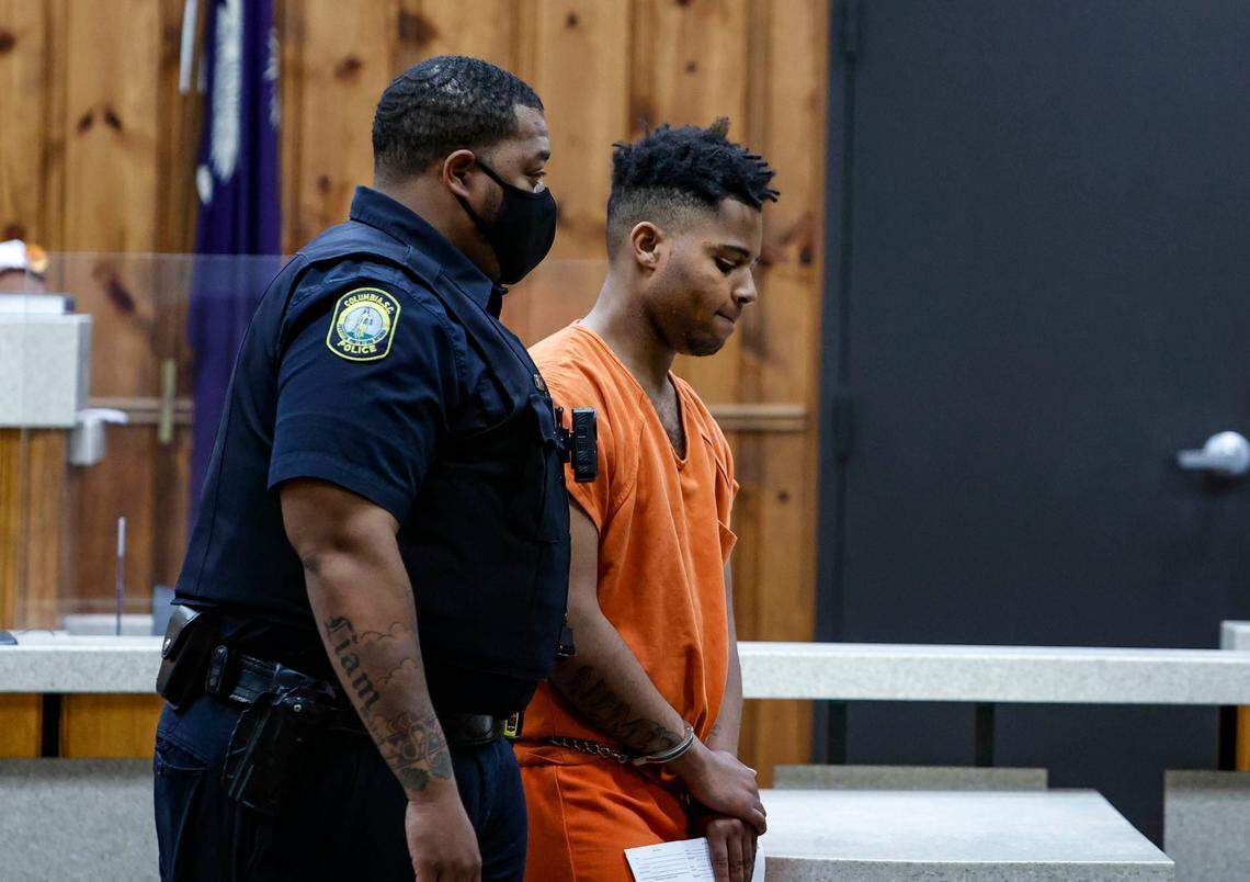 Marquise Love Robinson is escorted from Columbia Municipal Court after having his bond denied during a hearing at Columbia Municipal Court on Tuesday, April 19, 2022.