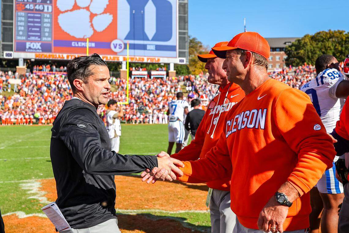 Head coach Manny Diaz of the Duke Blue Devils greets coach Dabo Swinney of the Clemson Tigers at midfield after a football game at Memorial Stadium on November 01, 2025 in Clemson, South Carolina.