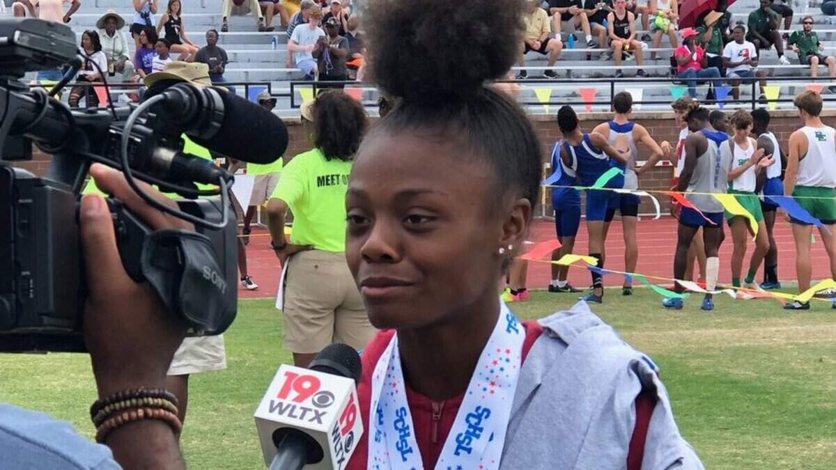 Airport’s Jayla Jamison talks to reporters after winning four events at the SC track and field championships on May 11, 2019.