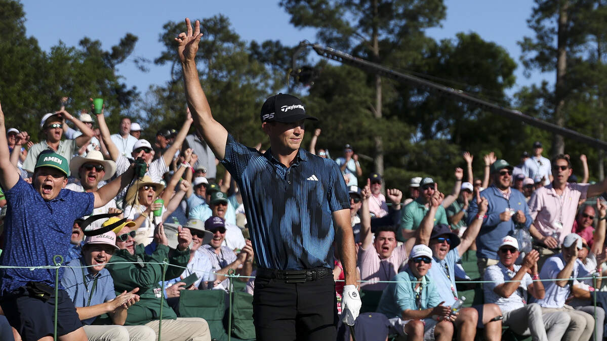 Jacob Bridgeman of the United States reacts after chipping in on the 18th green Thursday during the first round of the 2026 Masters Tournament at Augusta National Golf Club.