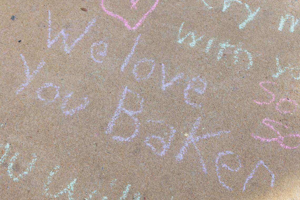 South Carolina students leave messages and flowers at a memorial for South Carolina student Nate Baker, who died after a hit-and-run crash on the intersection of Blossom Street and Assembly Street on Friday, April 4, 2025.