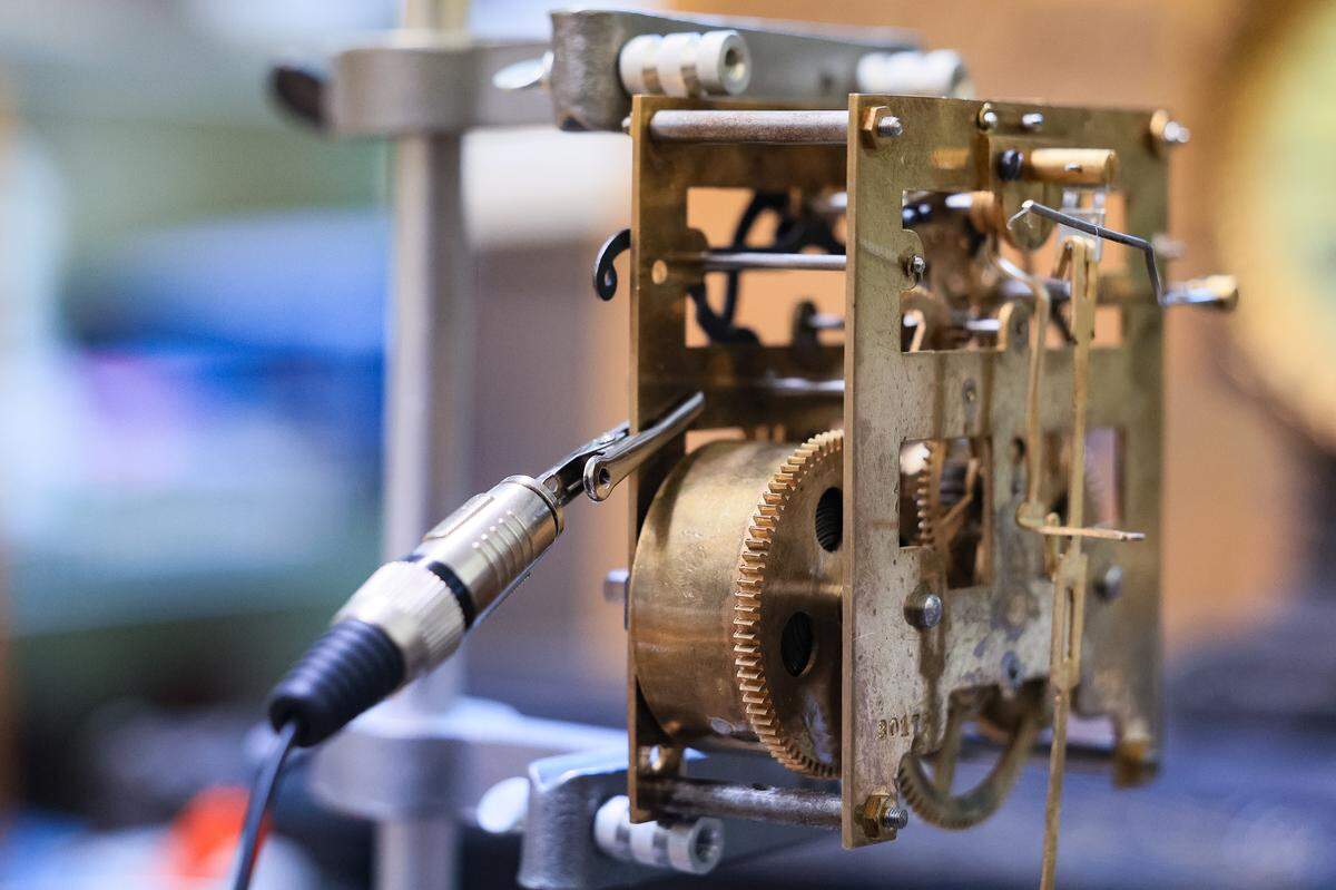 A clock movement is attached to a clock timing machine in the workshop of Second Hand Time in Chapin, South Carolina, on Friday, Dec. 19, 2025. Harold MacVittie calls the device a “clock stethoscope,” because the device makes it easier to hear the clock tick.