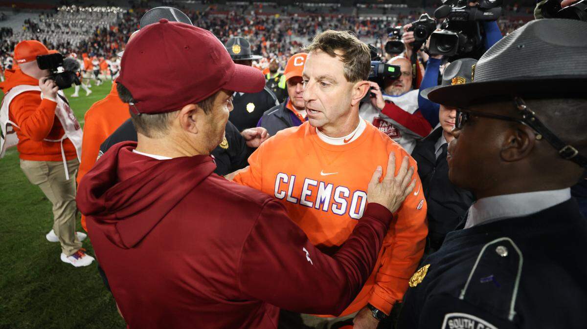 South Carolina head coach Shane Beamer speaks with Clemson head coach Dabo Swinney following South Carolina’s game against Clemson at Williams-Brice Stadium in Columbia on Saturday, November 25, 2023.