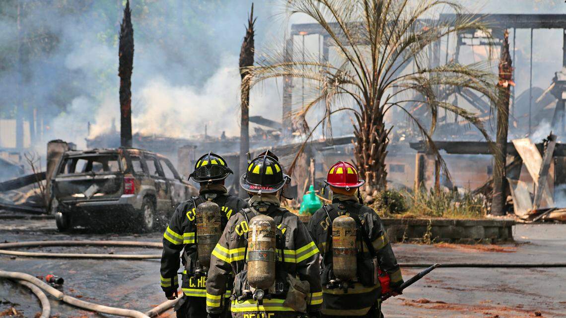 A Columbia fire crew continues the cleanup stage of a fire that engulfed a home on Kennerly Road in Irmo, Monday, May 9, 2016.