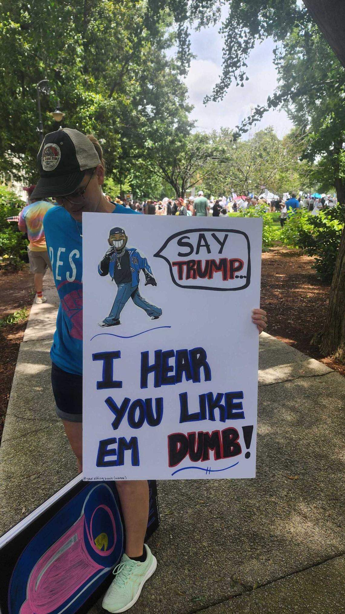 A protester at the South Carolina State House Saturday, June 14, 2025, wields a sign opposed to Donald Trump featuring Grammy Award Winning Rapper Kendrick Lamar.