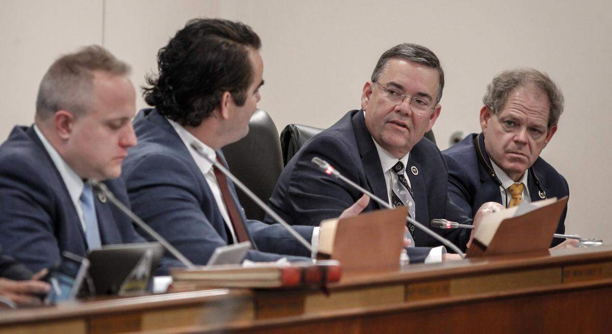 Rep. John McCravy, second from right, and Rep. Weston Newton listen to Rep. Micah Caskey during a House Judiciary Committee meeting in Columbia, S.C. on Tuesday, March 8, 2022. (Travis Bell/STATEHOUSE CAROLINA)