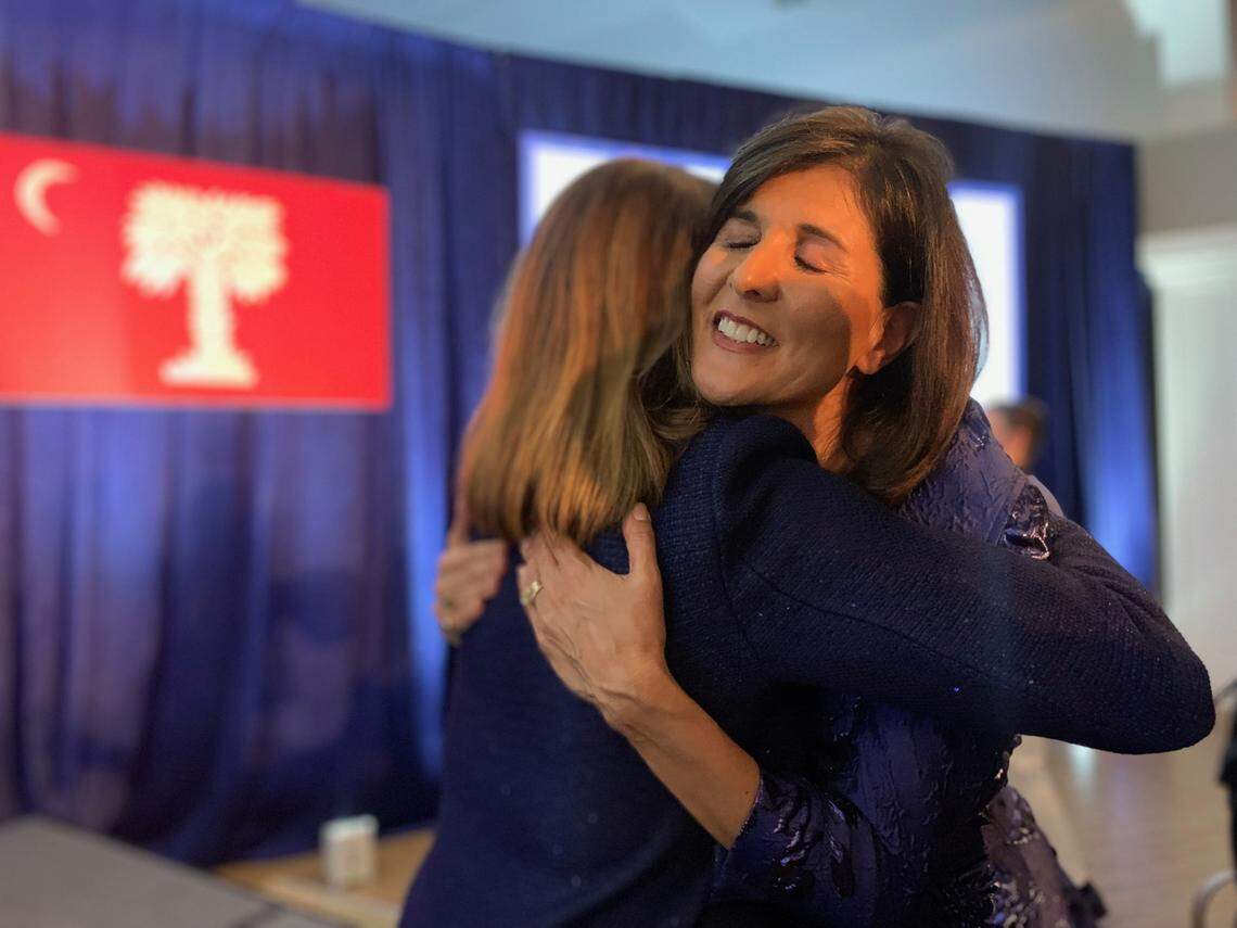 Nikki Haley, a former U.N. Ambassador and former South Carolina governor, hugs Allison Dean Love in Charleston after speaking at The Citadel Republican Society’s Patriot Dinner on Thursday, Dec. 2, 2021.