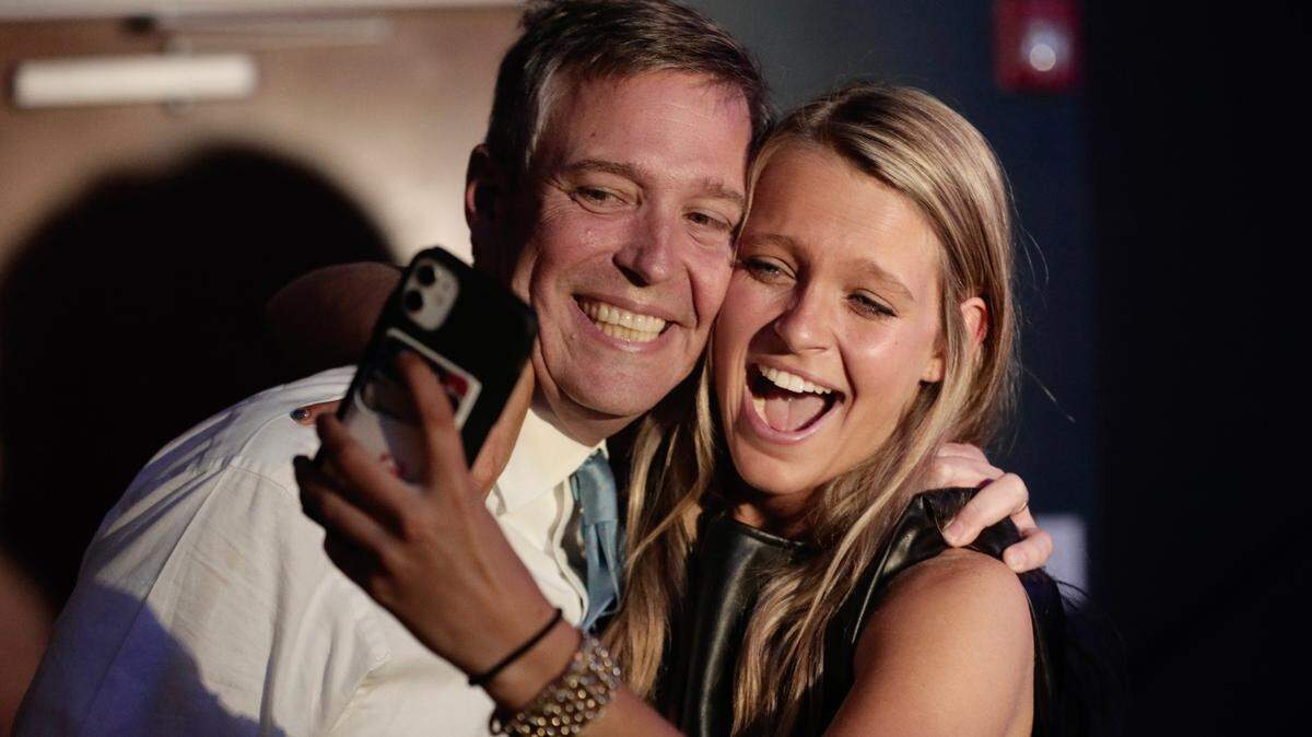 Daniel Rickenmann celebrates with his daughter, Ellie, on Tuesday, Nov. 16, after being elected Columbia mayor.