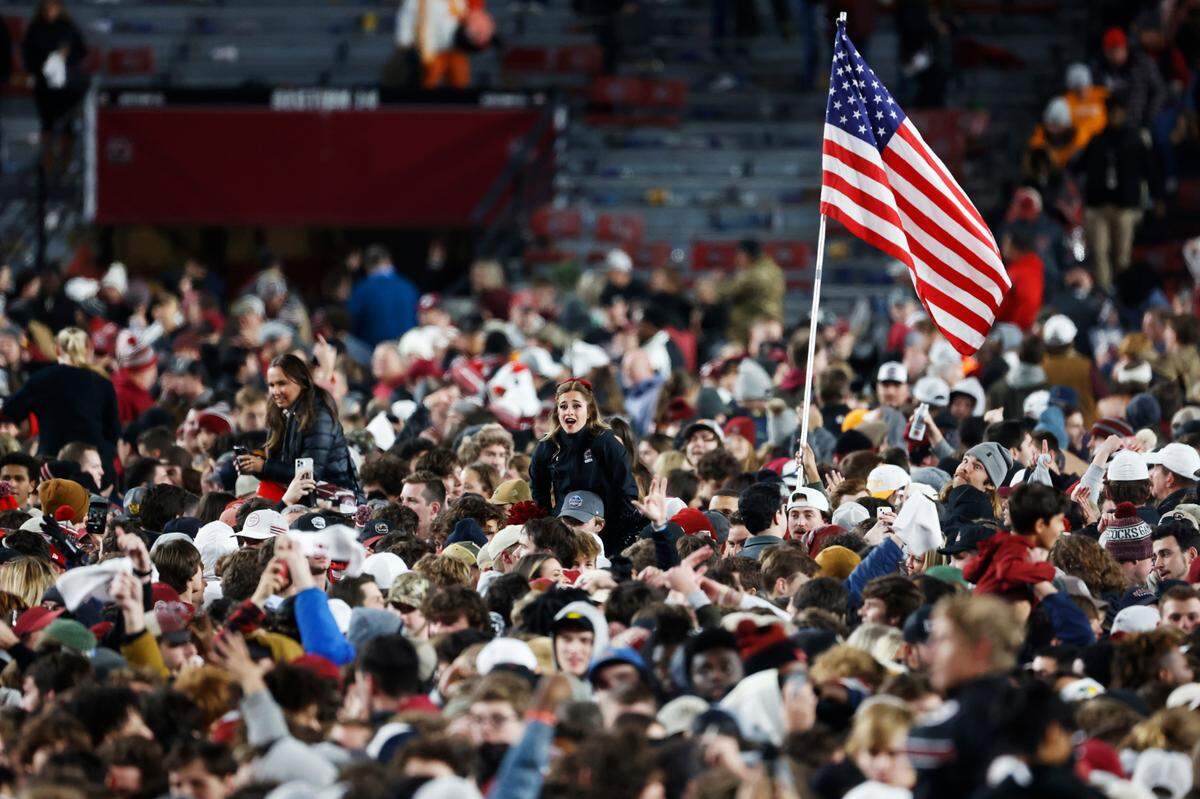 South Carolina fans rush the field after defeating Tennessee on Saturday, November 19, 2022.
