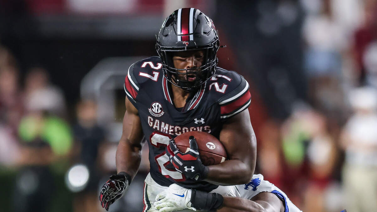 South Carolina running back Oscar Adaway III (27) carries the ball as Kentucky linebacker Kam Olds (1) moves in for the tackle during the Gamecocks’ game against Kentucky at Williams-Brice Stadium in Columbia on Saturday, September 27, 2025.