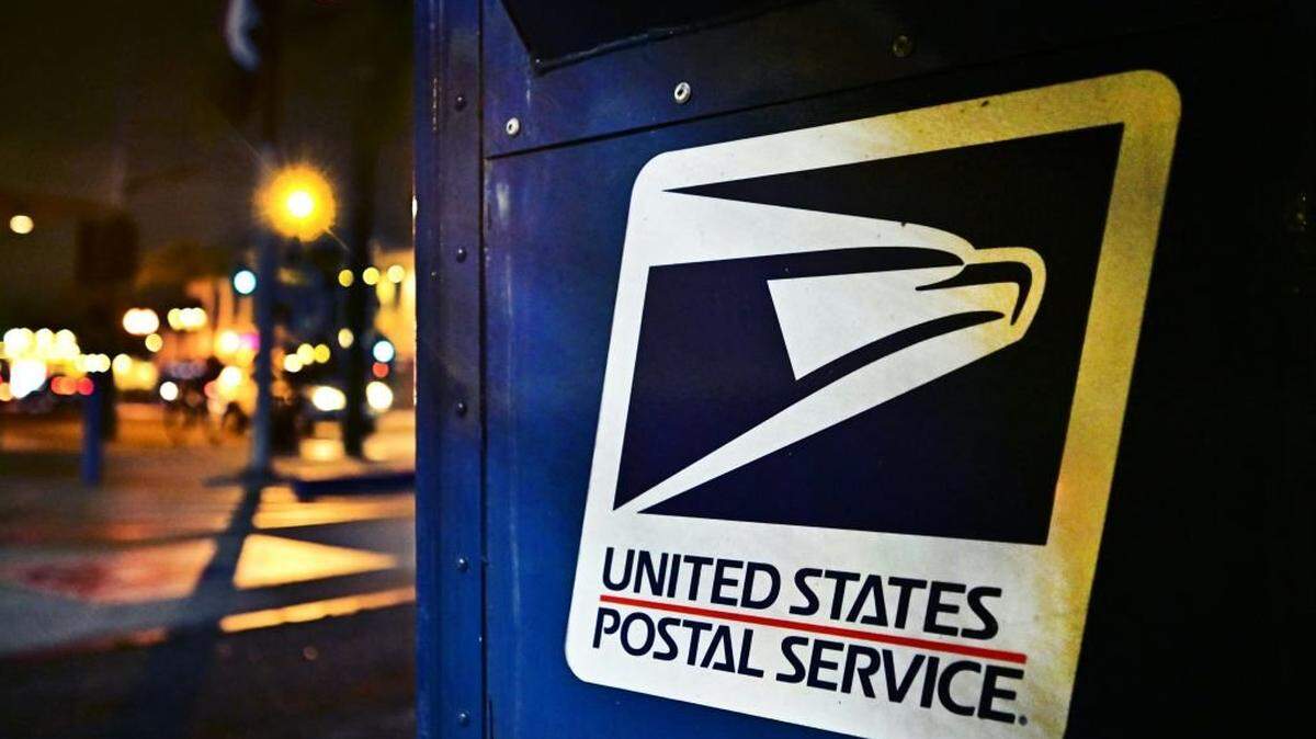 The United State Postal Service emblem is seen on the side of a mailbox in Monterey Park, California on February 4, 2025. The US Postal Service (USPS) said February 4, 2025 it was temporarily suspending inbound parcels from China and Hong Kong, shortly after President Donald Trump's imposition of fresh tariffs targeting Beijing. The halt will take place "until further notice," and follows Trump's order for an additional 10 percent levy on Chinese imports starting Tuesday. (Photo by Frederic J. BROWN / AFP) (Photo by FREDERIC J. BROWN/AFP via Getty Images)