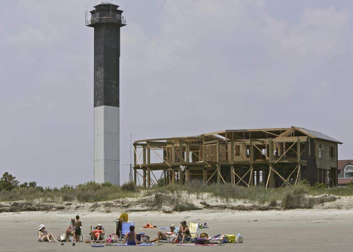 Beach goers soak up sun and fun near Station 18 on Sullivan’s Island, near the famed Sullivan’s Island Lighthouse.