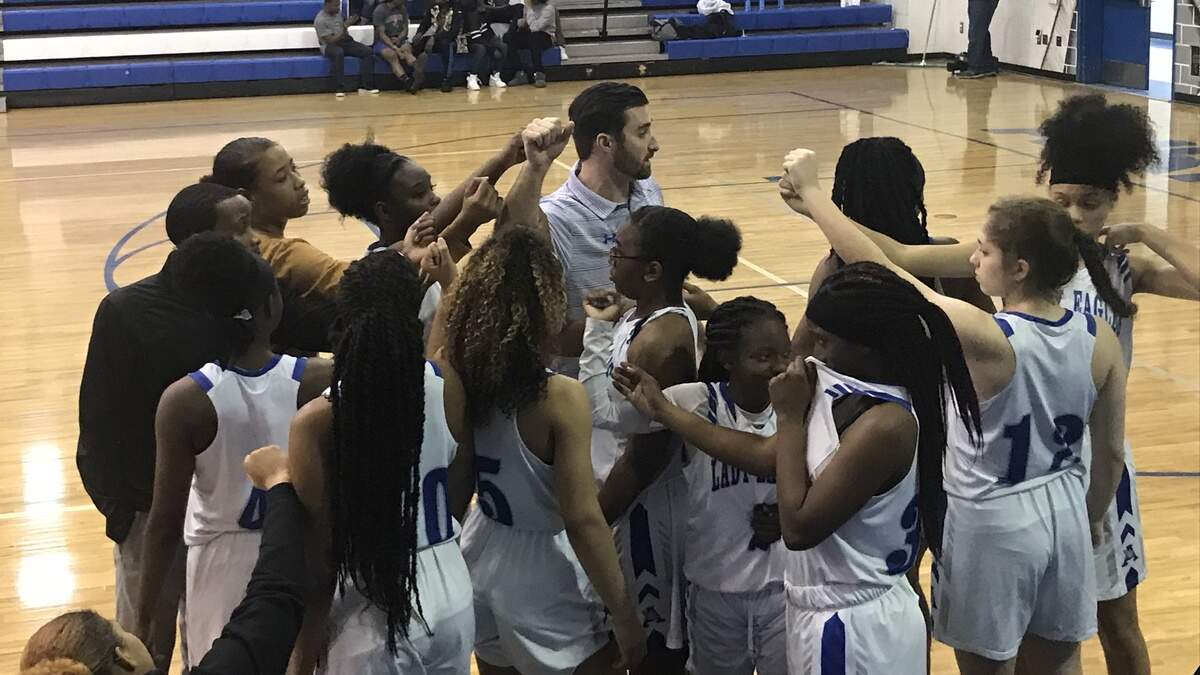 The Airport girls basketball team breaks the huddle before its 4A first round playoff game against Hartsville. The Eagles won, 52-43.