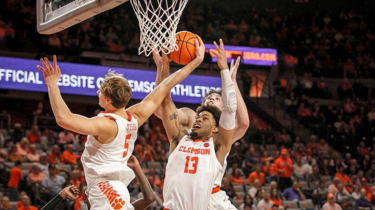 Clemson forward Hunter Tyson (5), guard David Collins (13) and forward PJ Hall (24) go after a missed South Carolina shot during action in Clemson, S.C. on Saturday, Dec. 18, 2021.