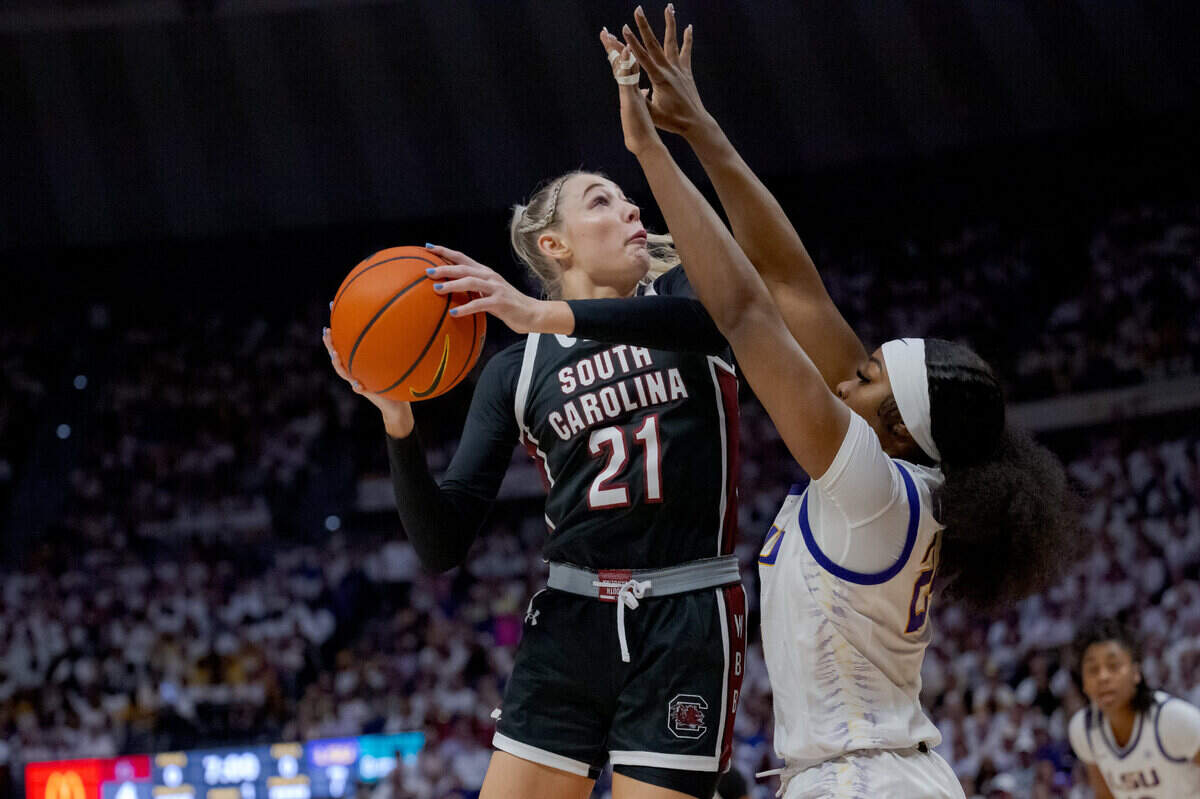 Jan 25, 2024; Baton Rouge, Louisiana, USA; South Carolina Gamecocks forward Chloe Kitts (21) shoots against LSU Tigers guard Aneesah Morrow (24) during the first half at Pete Maravich Assembly Center. Mandatory Credit: Matthew Hinton-USA TODAY Sports