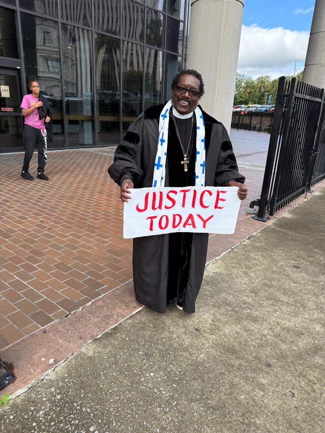 Rev. Raymond Johnson, a fixture at Russell Laffitte and Alex Murdaugh hearings for four years, stands outside the Richland County courthouse Monday. 