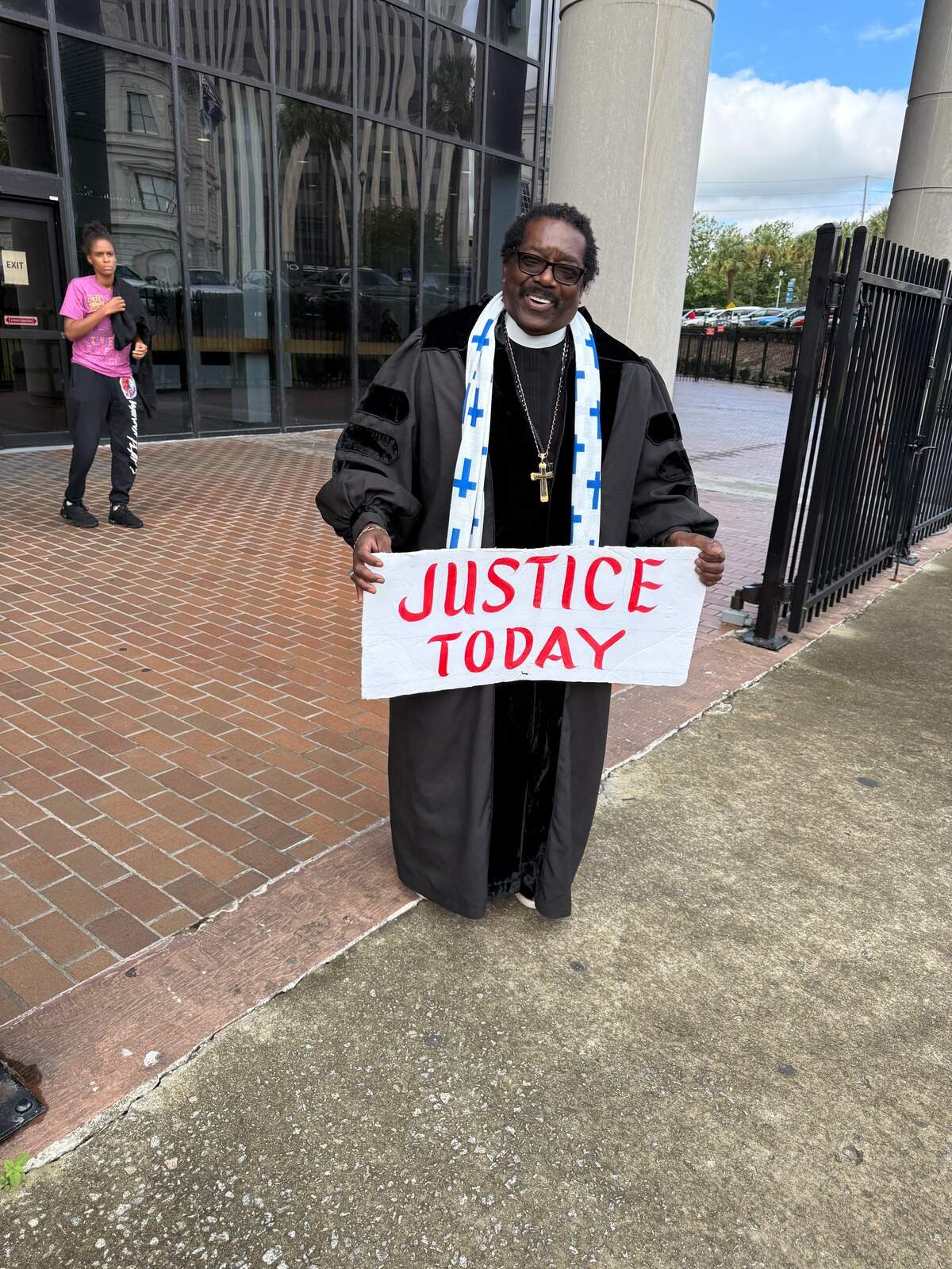 Rev. Raymond Johnson, a fixture at Russell Laffitte and Alex Murdaugh hearings for four years, stands outside the Richland County courthouse Monday.