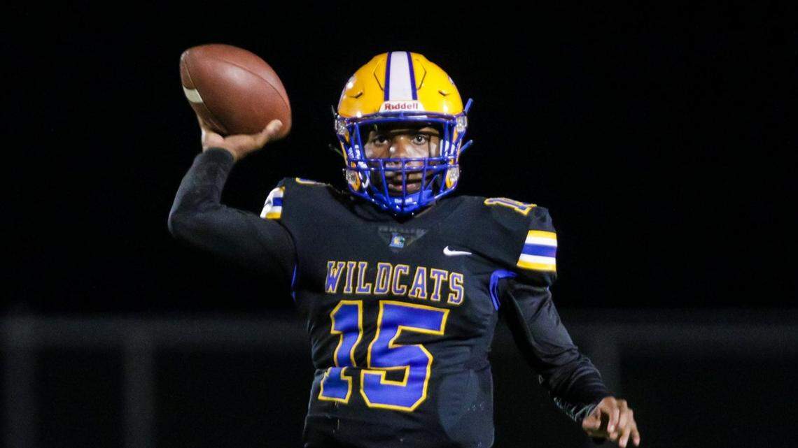 Lexington Wildcats quarterback Taiden Mines (15) passes against the Irmo Yellowjackets.
